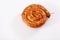 Snail sausage in traditional spiral on white background. Grilled round sausages . Delicious barbecue. There is a