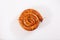 Snail sausage in traditional spiral on white background. Grilled round sausages . Delicious barbecue. There is a