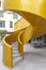 snail-shaped concrete exterior stairs painted in gold