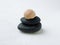 Snail shell on pebble stack.