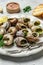 Snails baked with sauce, Bourgogne Escargot Snails. Baked snails with butter and spice. gourmet food. vertical image. top view.