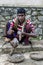 A snake charmer with his cobra and python posing for a photograph at Pinnawela in Sri Lanka.