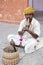 Snake charmer intertaining tourist in the streets Rajasthan Jaipur India