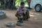 Snake charmer plays with indian cobra