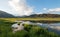 Snake River morning reflections along grassy banks at Alpine Wyoming