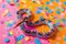 Snake a symbol of 2025 year with Christmas tree toy ball in a shiny blurred festive background.
