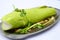 Snakehead fish steamed gourd with onion and herbs on white background