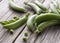 Snap peas on an old wooden board