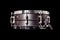 Snare on a black background, musical instrument, musical concept.
