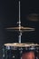 Snare drum and cymbals on a black background.