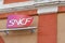 SNCF logo and sign on station wall National society of French railway company in