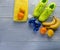 Sneakers dumbbells towel bottle of water bananas lemon and oranges