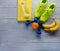 Sneakers dumbbells towel bottle of water bananas and oranges