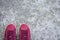 Sneakers of pink suede on the sidewalk