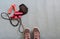 Sneakers ready to training at home, making exercise in a fitness class with muscular equipment. Jumping rope, pink dumbbells and