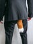 Sneaky businessman in black suit with a fox tail.