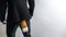 Sneaky businessman in black suit with a fox tail. Concept crime, fraud