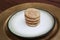 Snickerdoodle cookies stacked on a golden plate