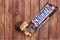 Snickers chocolate bar on wooden background