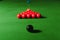 Snooker balls on green surface, shallow depth of field