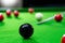 Snooker balls on the green table for playing entertainment of man