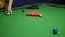 Snooker. close-up . male hands with cue playing billiards