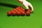 Snooker table and balls referee arranging balls