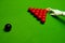 Snooker table and balls with referee arranging the balls