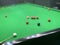 Snooker wooden cue, balls and table in indoor private room