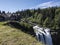 Snoqualmie, WA / USA - circa May 2020: View of the gorgeous Snoqualmie Falls with Salish Lodge and Spa in the background, on a