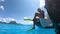 Snorkel diving excursion boat tour from yacht luxury travel influencer going swimming in coral reefs of Tahiti, French