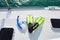 Snorkel equipment on the luxury yacht deck. Blue goggles and lime fins.