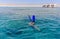 Snorkeler diving below the sea
