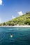 A snorkeler at an island coral reef with turtle. Seychelles.