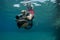 Snorkeler on underwater scooter