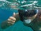 Snorkeler woman underwater in Kolona double bay Kythnos island Cyclades Greece, Aegean sea.