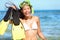 Snorkeling fun on beach - woman showing fins