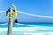 Snorkeling mask hanging on the wooden pier stake