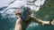 Snorkeling near a tropical island. Young man swims in the water. Sea vacation.