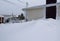 Snow accumulation around a house