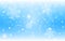 Snow background blue. Christmas snowfall with defocused flakes. Winter concept with falling snow. Holiday texture and