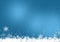 Snow background blue. Christmas snowfall with defocused flakes. Winter concept with falling snow. Holiday texture and white