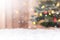 Snow background with bokeh of decorated Chritmas tree