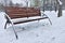 Snow bench in the winter park, rest in the park