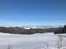 Snow blanket covers the hills in a countryside in winter