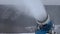 Snow cannon making snow at ski resort in slow motion