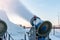 A snow cannon sprays artificial ice crystals. Artificial snowmaking system.