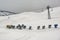 Snow canon at ski resort with mountains on background