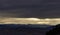 snow capped apennine mountains and valley  in a cloudy sunset