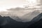 Snow capped Karakoram mountain range with morning fog in Nagar valley